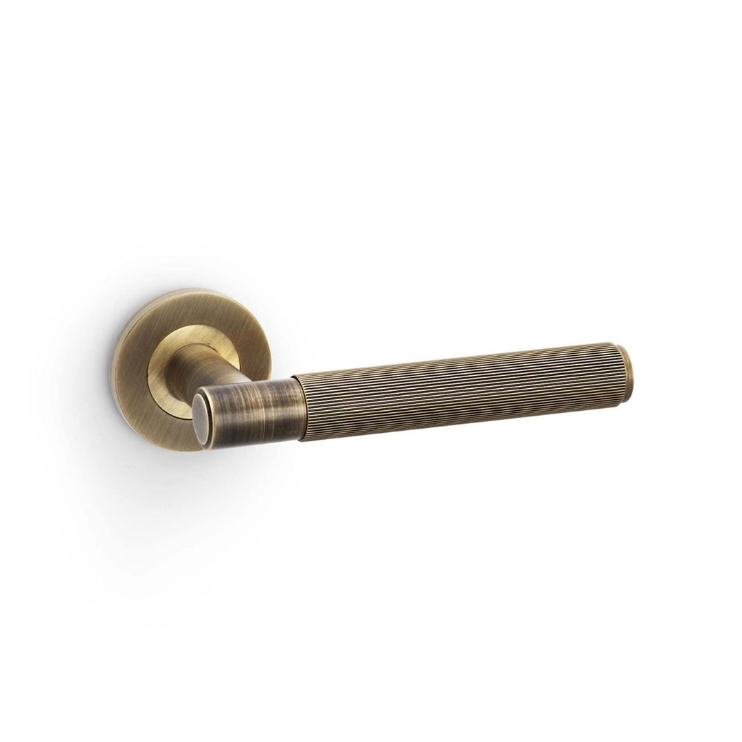 Spitfire Reeded Lever on Rose (A/W) Pair - Antique Brass (AB)